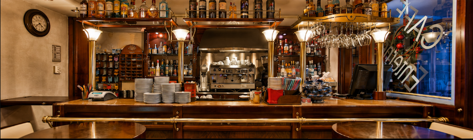The interior of Enterne Café, warm wood tones and soft evening light